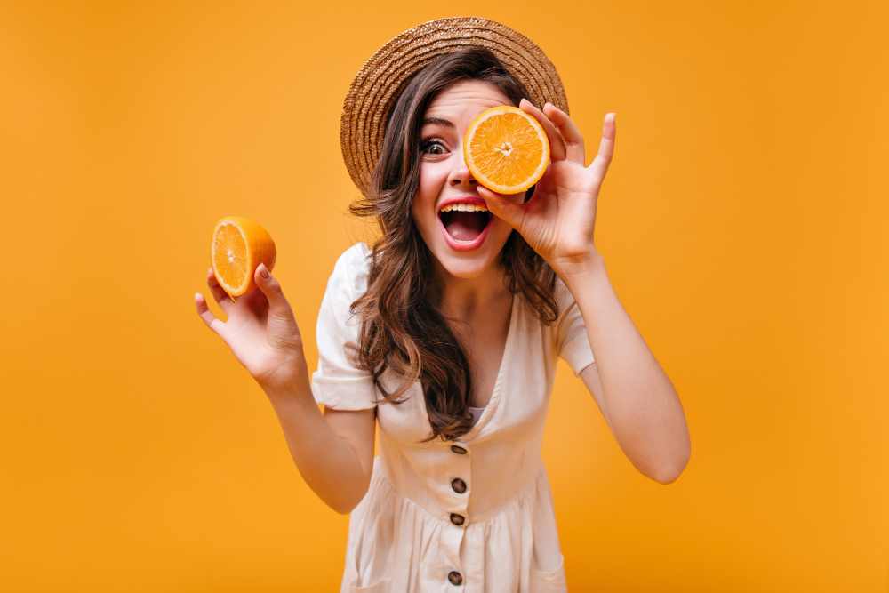 girl cotton dress straw hat is having fun posing with oranges isolated background 11zon