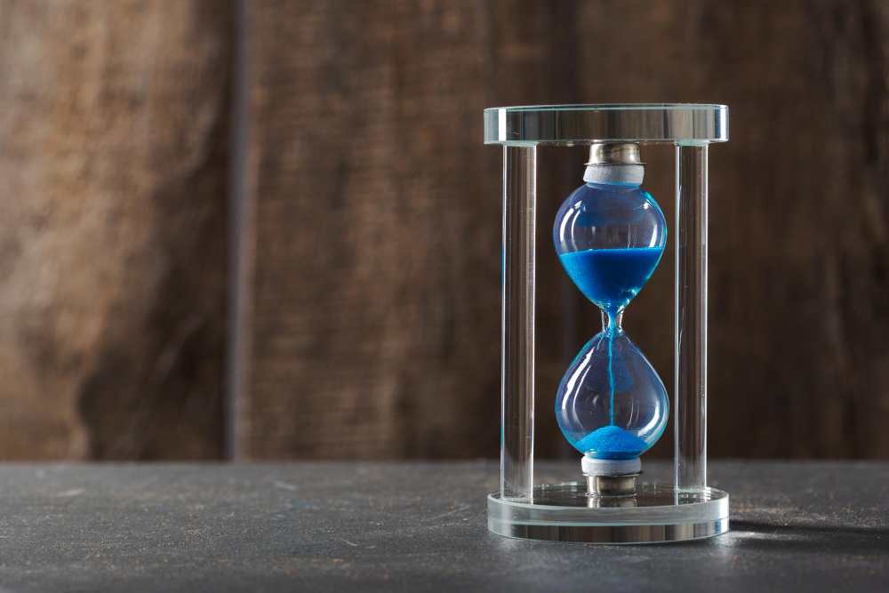 time is passing blue hourglass close up 11zon